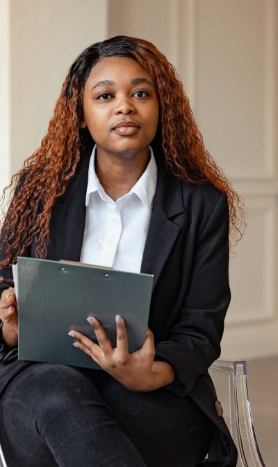 A counselor attentively listens during a therapy session, fostering mental health support.